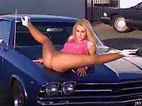 Hot girl Nikki Kane in pink mini dress and suntan pantyhose spreads her legs on the car and living room to show how flexible she really is