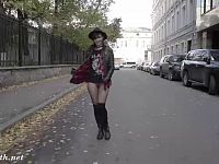 Pretty girl Jenny Smith walking on the street in her seamless pantyhose